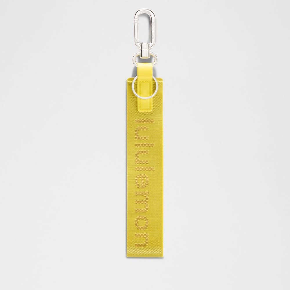 Lululemon | never lost keychain | daisy glow
